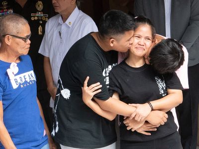 Filipino woman returns to joyous welcome from family after narrowly escaping firing squad