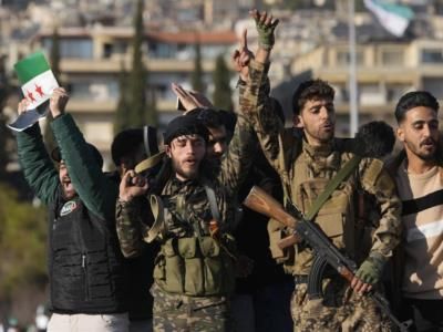 Former Syrian Regime Forces Surrender Weapons To Rebel-Linked Government