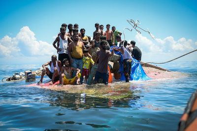 Sri Lanka's navy rescues 102 Rohingya refugees found adrift aboard a fishing trawler