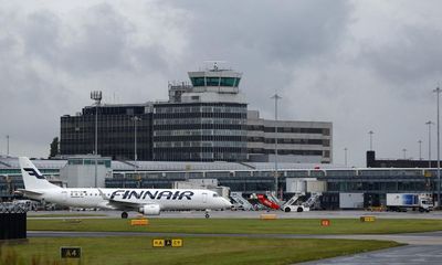 Two men charged over Manchester airport disturbance involving police