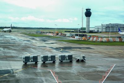 Two men charged with assaulting police after Manchester Airport incident