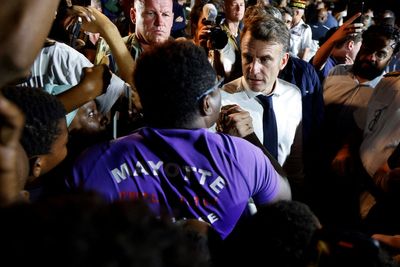 Macron swears during angry exchange with heckling crowd while visiting cyclone-battered Mayotte