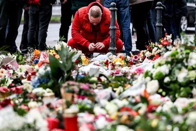 German market attack latest: Suspect made 2013 threat, minister reveals, as more rallies planned tonight