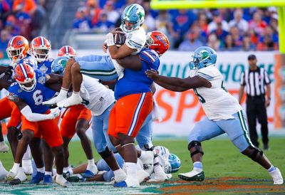 Florida’s 449-pound Desmond Watson rumbles for first down in Gasparilla Bowl