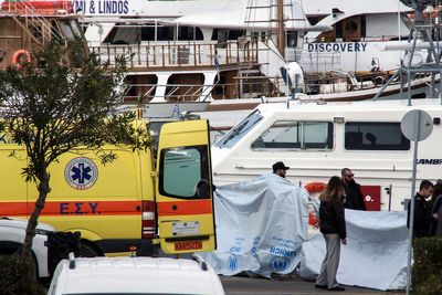 Greek authorities say boat capsizing victims and survivors were from Afghanistan. 2 Turks arrested