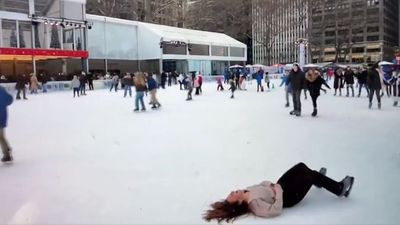 Ice Skater Falls Down at Bryant Park Live on CBS Jets-Rams Broadcast