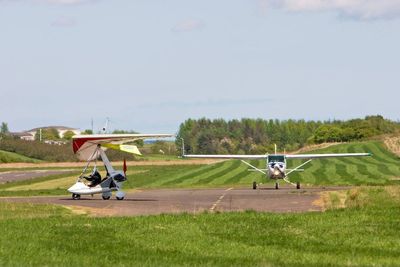 Emergency services at scene after light aircraft crashes near airport