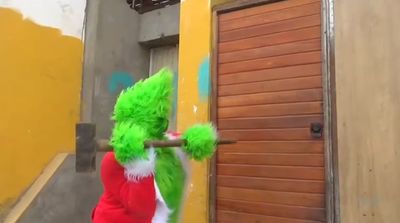 WATCH: Undercover Cop In Grinch Costume Busts Drug Gang In Christmas-Themed Raid