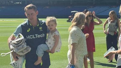 Dads' day out! Australian stars unwind with with wives, kids at MCG. Watch