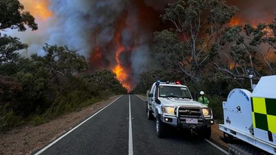 Wind change fans unpredictable fires as towns evacuated