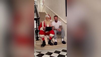 David Beckham sings Christmas classic with Santa as daughter Harper watches on