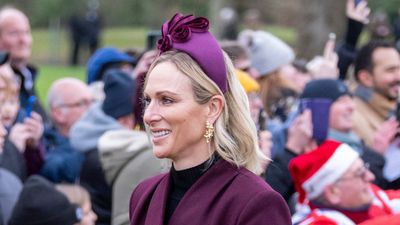 Zara Tindall keeps it classic for Christmas Day in a timeless coat dress and matching statement headband - the outfit formula is her tried and tested go-to