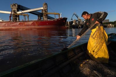 AP PHOTOS: A river route for food and crime: The dual nature of a major South American waterway