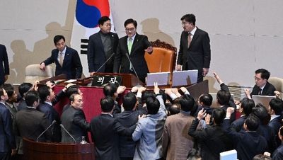 Chanting South Korean ruling party lawmakers swarm parliament in protest of impeachment vote