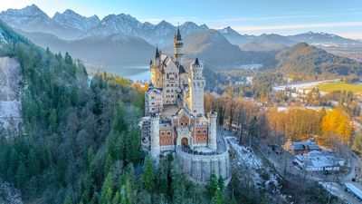 I climbed a snow-capped mountain and photographed the real Cinderella Castle from above with my DJI drone