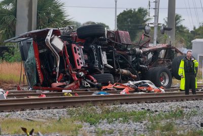 Train collides with fire truck in Florida. Police say 3 firefighters and several passengers hurt