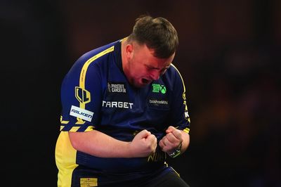 Luke Littler defies slow start to beat Ian White and reach World Darts Championship last 16