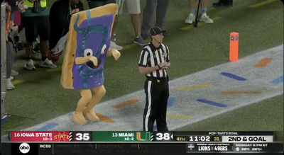 A Pop-Tarts Bowl mascot sneaking up behind a referee was nightmare fuel