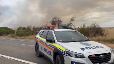 Bushfire threat finally eases but warnings to last days