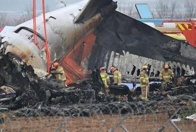 Flags Fly At Half-mast As S. Korea Probes Its Worst Plane Crash