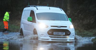 Traffic battles through flooding as roads and trains disrupted amid heavy rain