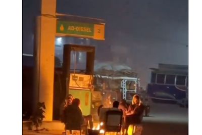 Social Media Users Shocked After Men Start a Campfire By a Gas Station Pump: 'Pure Madness'