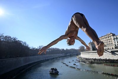 Italians dive into icy waters of Rome’s Tiber River to celebrate New Year