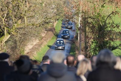 Community still in shock over deaths of father and son, funeral told