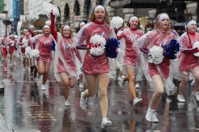 Revellers brave wind, rain and grey skies to watch New Year’s Day Parade