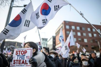 South Korea's Yoon Resists Arrest Over Martial Law Bid