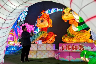 AP PHOTOS: A lantern workshop in China makes snakes cute for the Lunar New Year