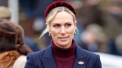 Zara Tindall strides into 2025 in style - her blue pinstripe blazer and wide leg trousers are effortlessly chic