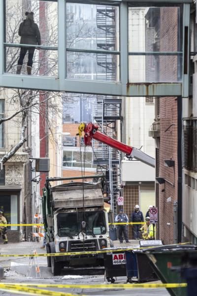 Garbage Truck Stuck In Sinkhole Causes Downtown Power Outage