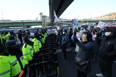 South Korea’s president Yoon Suk Yeol evades arrest after six-hour standoff