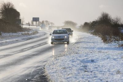 Travel warnings for road and rail issued as snow and ice hit UK