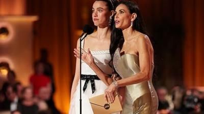 Margaret Qualley And Demi Moore Present At Golden Globes