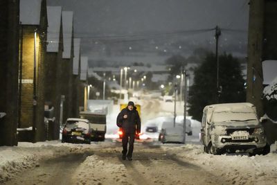 M25 closes due to lorry crash as commuters face travel disruption from snow, rain and ice