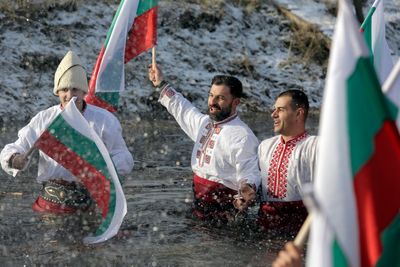 Bulgarians celebrate the feast of Epiphany with a ritual plunge into icy rivers