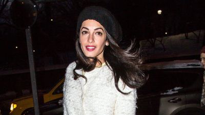 Amal Clooney's chic boucle coat, leather trousers, and cosy knitted hat prove winter layering doesn't have to be boring