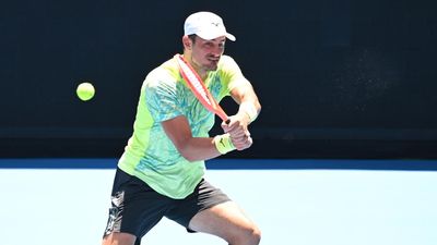 Tomic and Hewitt among early exits at Open qualifying