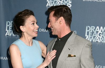 Hugh Jackman and Sutton Foster pictured holding hands