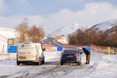 Flights disrupted and schools closed for second day as wintry weather continues