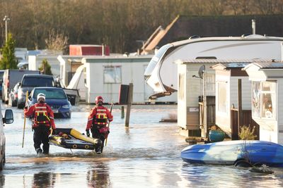 Danger to life flood warning issued as dozens of people rescued by firefighters