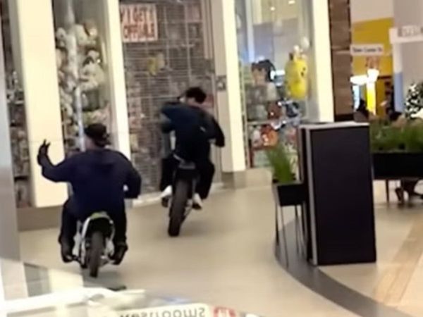 Chaos as dirt bike riders race through food court in bustling California shopping mall