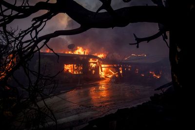 Wildfire burns through LA enclave known for its beaches and celebrity allure