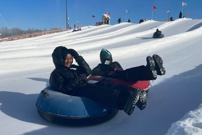 Scarves over headscarves, Muslim women’s outdoors group tackles snow tubing in Minnesota