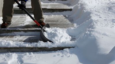 Experts reveal the best way to shovel snow safely and effectively – and how a secret trick with cooking oil can prevent injury