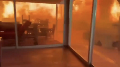 WATCH: 2 Men and Dog Trapped in LA Home Surrounded by Flames as Wildfire Closes In