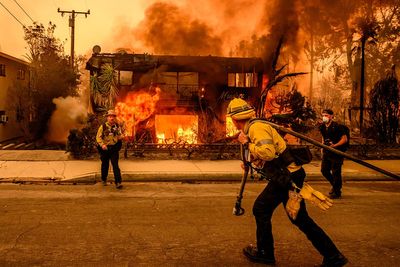 Los Angeles wildfires could worsen with wind gusts as 20 looters arrested