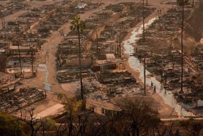 Los Angeles’ two biggest fires burn at least 10,000 structures while new blaze leads to more evacuations